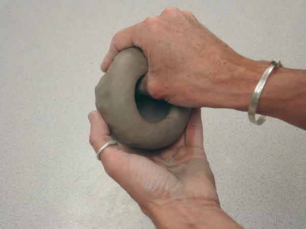 widen the hole - pinch pot