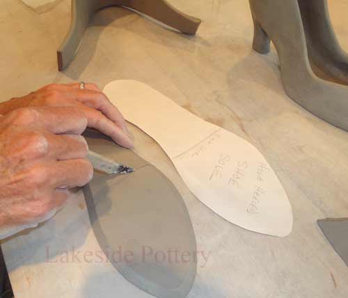 getting slab clay pieces ready for construction