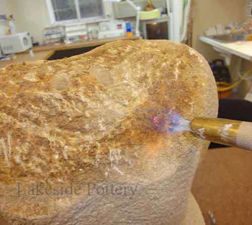 use torch to remove old hadhesive