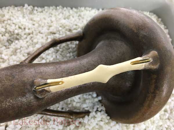 Metal peg insersion pottery repair