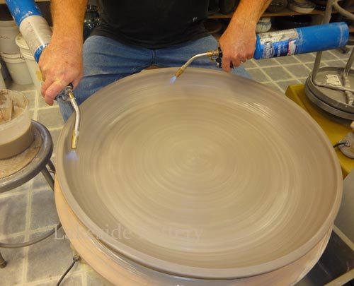 you may use torch or wait until the wall is hard enough to accept the next coil