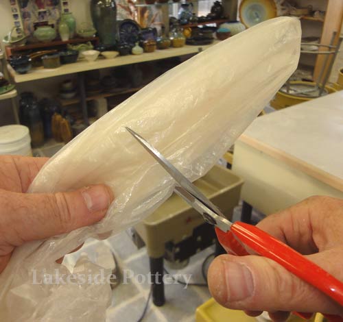 make a hole in a dry cleaning bag