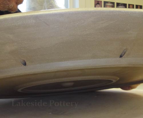 drill holes on pot's foot for wall hanging if desired